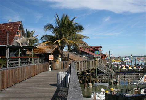 City of madeira beach - John's Pass Park is located on the south end of Madeira Beach directly across Gulf Blvd from John's Pass Village & Boardwalk. John's Pass Park offers metered parking spots directly by the beach with a wooden walkover, public restrooms, an outdoor shower area, covered picnic area, and chair rentals. 